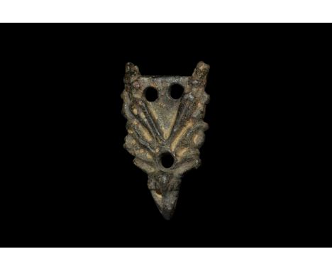 11th century AD. A bronze stirrup mount of Williams's Class A Type 8, triangular with bear-head finial and acanthus-leaf chev