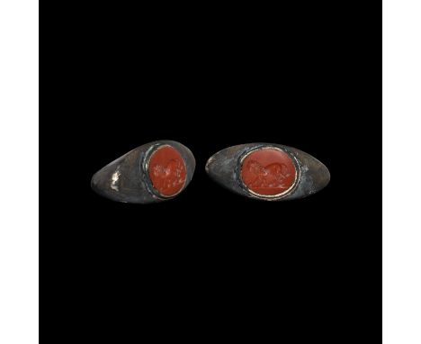 3rd century AD. A substantial silver ring, a marriage of a D-section hoop with expanding shoulders, flat scaphoid plaque with