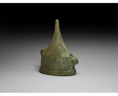 1st millennium BC. A bronze cup comprising an elliptical-section bowl with collar and rounded rim, conical spike to the under