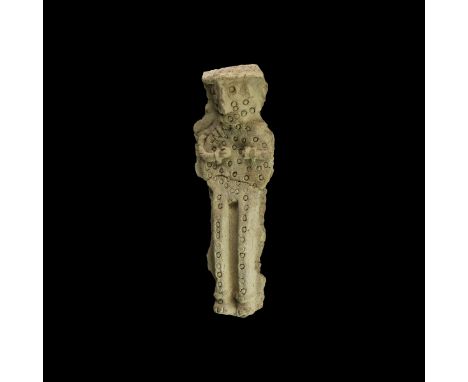 2nd millennium BC. A ceramic figure with raised discoid body and rectangular legs decorated with impressed roundels, head til