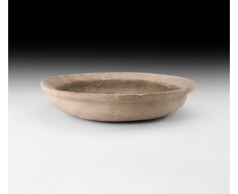 1st-3rd century AD. A broad ceramic patera with flange rim.   1.7 kg, 31cm (12 1/4"). Property of a North London gentleman; a
