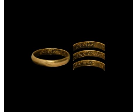 Early 18th century AD. A substantial gold finger ring with text to the inner face in a seriffed italic hand 'In thee I find c