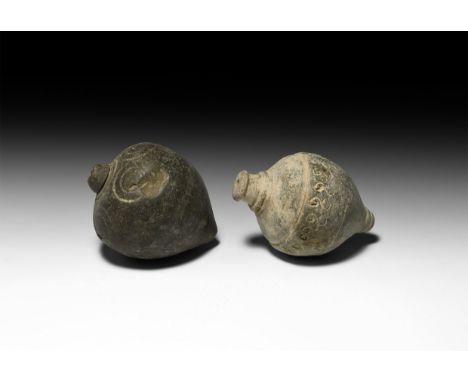 9th-11th century AD. A pair of hollow ceramic vessels each with conical body, intended to be filled with explosive liquid and