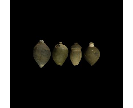 9th-11th century AD. A group of four hollow ceramic vessels each with conical body, intended to be filled with explosive liqu