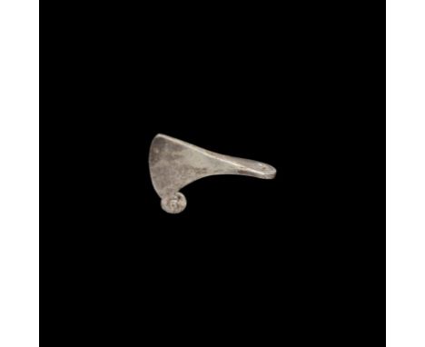 9th-11th century AD. A miniature silver axe pendant with wide triangular-section blade, circular chin with stamped pellet-in-