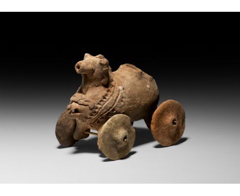 3rd-2nd millennium BC. A ceramic standing animal toy in the form of a spouted vessel with collared aperture on back and nose 