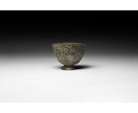 10th-12th century AD. A sheet-bronze miniature offering cup with flared foot, lotus-leaf band to the lower body and scrolled 