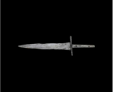 14th-15th century AD. A hand-forged iron scale-tang dagger with flat triangular blade, inset silver hook motif to one face, r