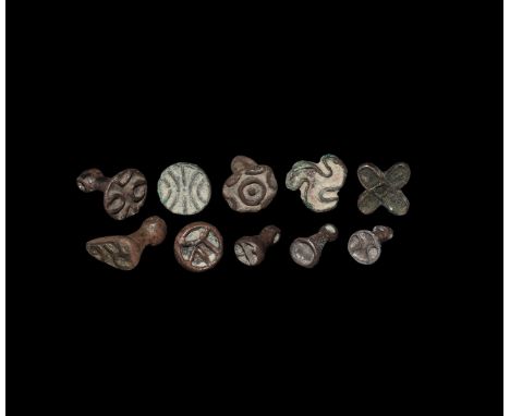 Late 3rd-2nd millennium BC. A mixed group of bronze seals of various shapes and designs including eight accompanied by typed 