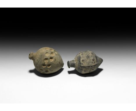 9th-11th century AD. A pair of hollow ceramic vessels each with conical body, intended to be filled with explosive liquid and