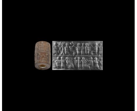 2550-2400 BC. An agate(?) cylinder seal, accompanied by a scholarly note, which states: 'The seal image is divided by two hor