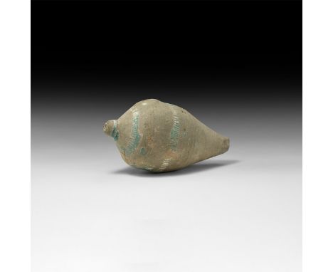 9th-11th century AD. A hollow blue-glazed ceramic vessel with domed top and conical base, intended to be filled with explosiv