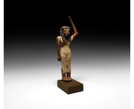 Middle Kingdom, 2050-1652 BC. A large wooden offering bearer figure from a tomb model, depicting a standing female wearing a 