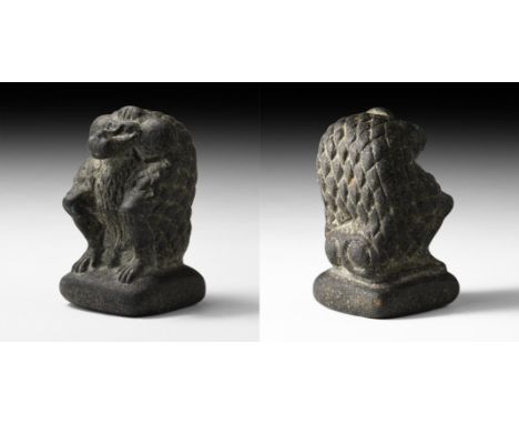 Late Period, 664-332 BC. A carved stone figure of Babi, or Thoth, the sacred baboon, crouching on a rectangular base.   130 g