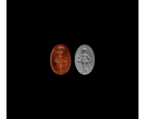 2nd-4th century AD. An oval red carnelian intaglio gemstone engraved with a standing figure.   0.91 grams, 13.78m (1/2"). Fro