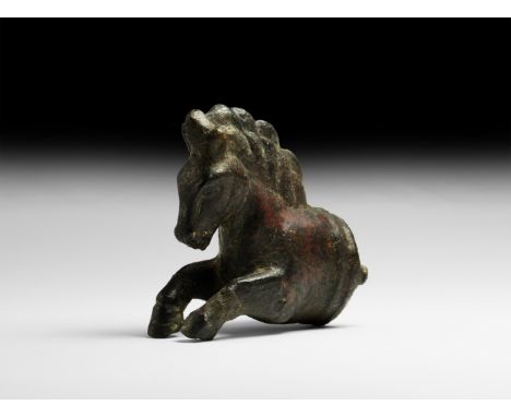 1st-2nd century AD. A hollow-formed bronze protome of a leaping horse with flying mane and forelegs extended; circumferential
