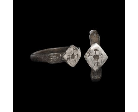 10-12th century AD. A silver ring with D-section hoop, lozenge-shaped bezel with incised standing figure.   2.31 grams, 19.12