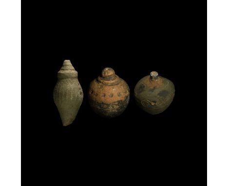 9th-11th century AD. A group of three hollow ceramic vessels each with conical body, intended to be filled with explosive liq