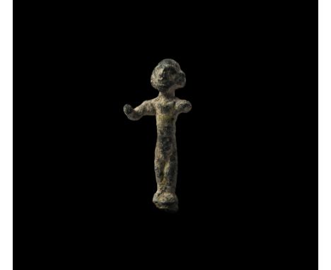 2nd millennium BC. A bronze figurine of a standing male with extended arms, wearing a large neck-ring, stylised facial featur