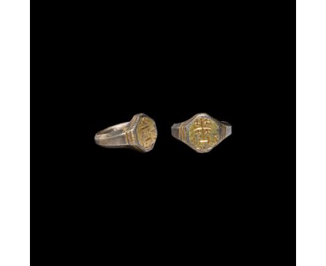 16th-17th century AD. A late Elizabethan or early Stuart period silver-gilt ring with facetted expanding hoop, octagonal beze