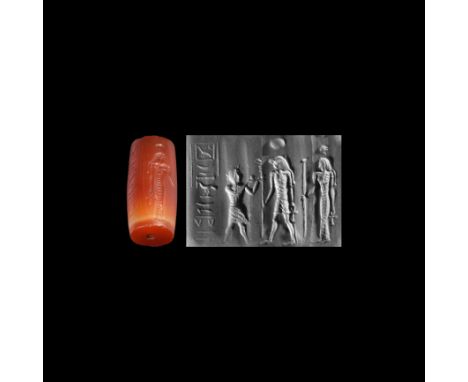 Late 4th century BC-early 1st century AD. An Egyptianizing carnelian cylinder seal with a column of pseudo-hieroglyphs, two a