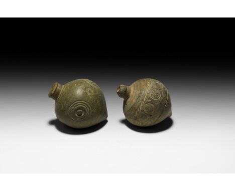 9th-11th century AD. A pair of hollow ceramic vessels each with conical body, intended to be filled with explosive liquid and