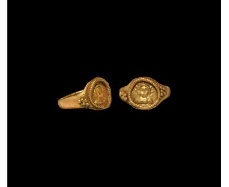 3rd-4th century AD. A gold finger ring with granule cluster to each shoulder, beaded wire collar enclosing a facing bust of S