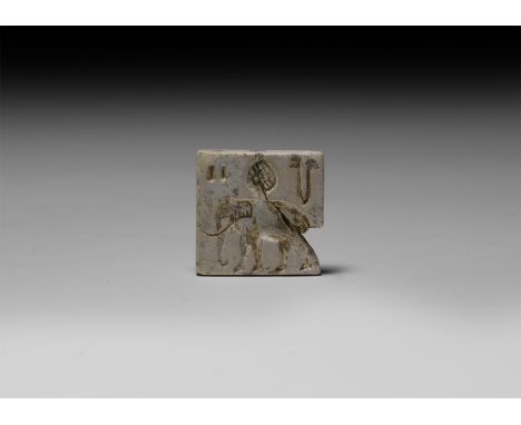 26th-19th century BC. A ceramic rectangular stamp seal with ribbed suspension loop, the underside with an image of an advanci