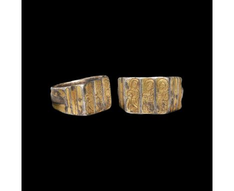 14th-15th century AD. A silver-gilt ring with grooved hoop, transverse ribbing to shoulders, the bezel with three engraved ni