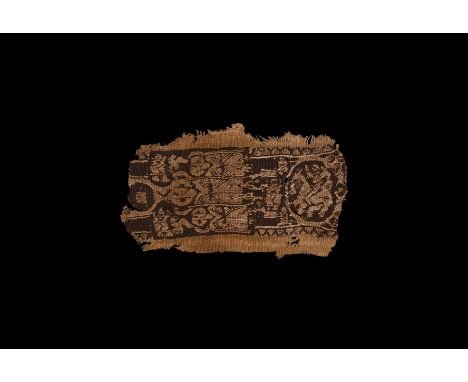 3rd-6th century AD. A decorative textile panel with embroidered design of a horseman in a roundel and three facing robed prie