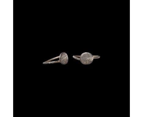 6th century AD. A silver ring with round-section hoop, discoid bezel inscribed with 'XEBO / I?ANN / OYS?EY / ??C'.   3.1 gram