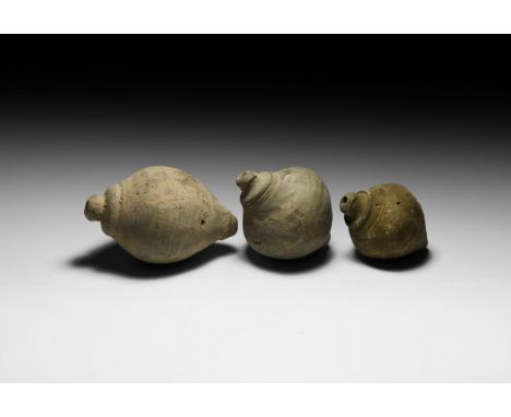 9th-11th century AD. A group of three hollow ceramic vessels each with conical body, intended to be filled with explosive liq