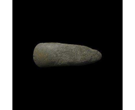 Neolithic, 6th-4th millennium BC. A ground axe with polished cutting edge, the bluntly pointed butt tapering to convex cuttin