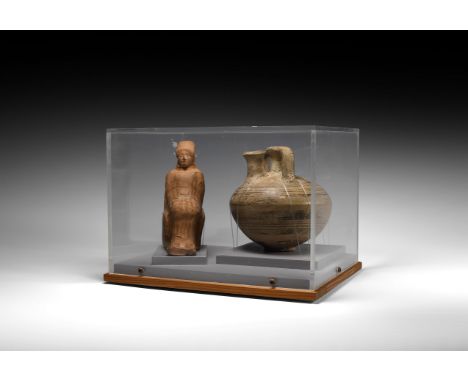 Late 2nd millennium BC-1st century BC. Two ceramic items: one goddess figure seated on a throne wearing draped garments and a