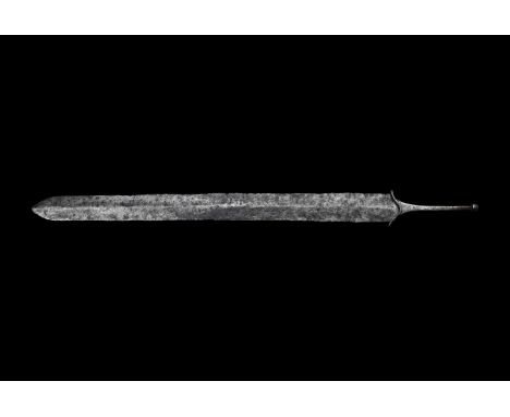 1st century BC-1st century AD. A double-edged sword of La Tène III type with deburred blade and raised midrib, slim tang with