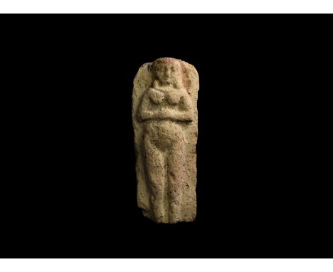 Mid 2nd millennium BC. A rectangular ceramic plaque displaying a figure of the female goddess Astarte (Ishtar) standing nude 