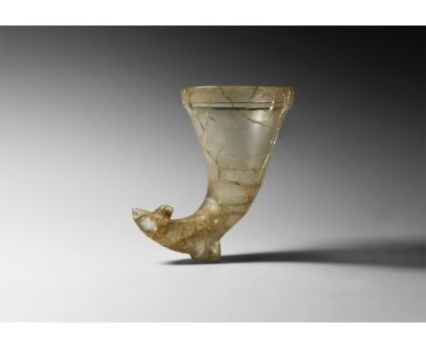 Late 1st-early 2nd century AD. A horn-shaped translucent rock crystal rhyton with animal-head terminal, possibly a dog or you