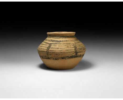 4th-3rd millennium BC. A squat ceramic jar with flared mouth, bands of black painted geometric design to the shoulder.   460 
