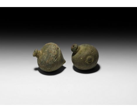 9th-11th century AD. A pair of hollow ceramic vessels each with conical body, intended to be filled with explosive liquid and