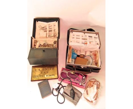 Vintage effects relating to midwifery to include a folding travelling case with multidivisional interior containing glass bot