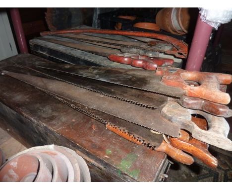 Two vintage tool chests containing an assortment of mainly carpentry related hand tools to include a quantity of saws, etc