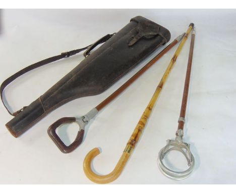A good quality vintage stitched leather "leg of mutton" gun case together with two vintage shooting sticks and a bamboo walki