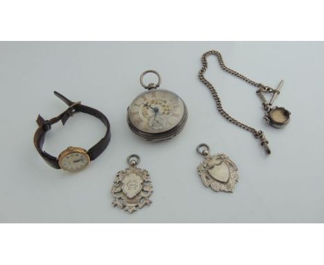 A sterling silver open-faced pocket watch, the silver engine-turned dial with gilt Roman numerals, central gilt floral decora