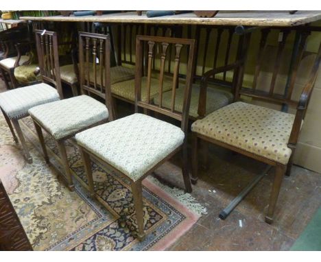 A set of eight (6&2) late 19th century mahogany dining chairs in a Regency style with pierced splat backs and raised on squar