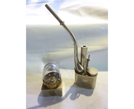 An eastern silver plated opium pipe with chased foliate detail, etc together with a small Chinese oil burning lamp raised on 