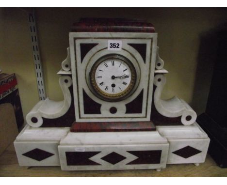 A Victorian white marble and coloured marble mantle clock of classical form enclosing an 8 day time piece