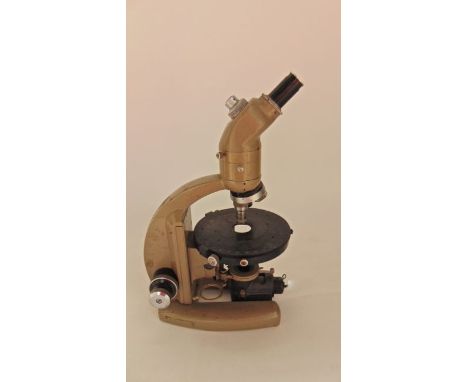 A vintage laboratory microscope bearing plaque reading Made in England by Vickers Instruments, Inst No M70/2/148, Pat No 8778