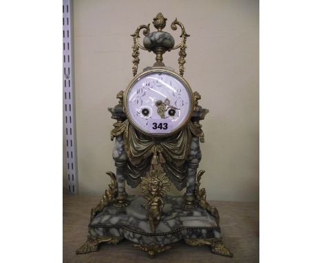 A 19th century marble and gilt spelter mantle clock, the eight day striking movement with painted enamel dial, mounted on two