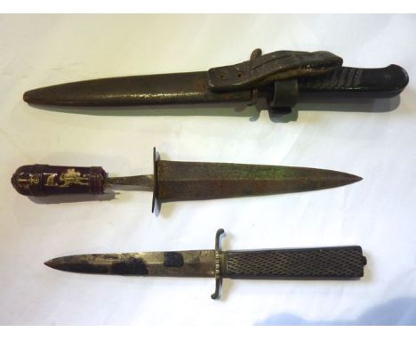 An early 20th century military dagger in leather and steel scabbard together with two other examples