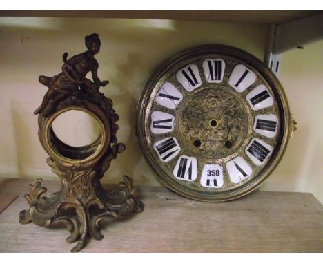 A 19th century cast brass clock dial with enamelled numerals, 29 cm diameter approximately together with a further Victorian 